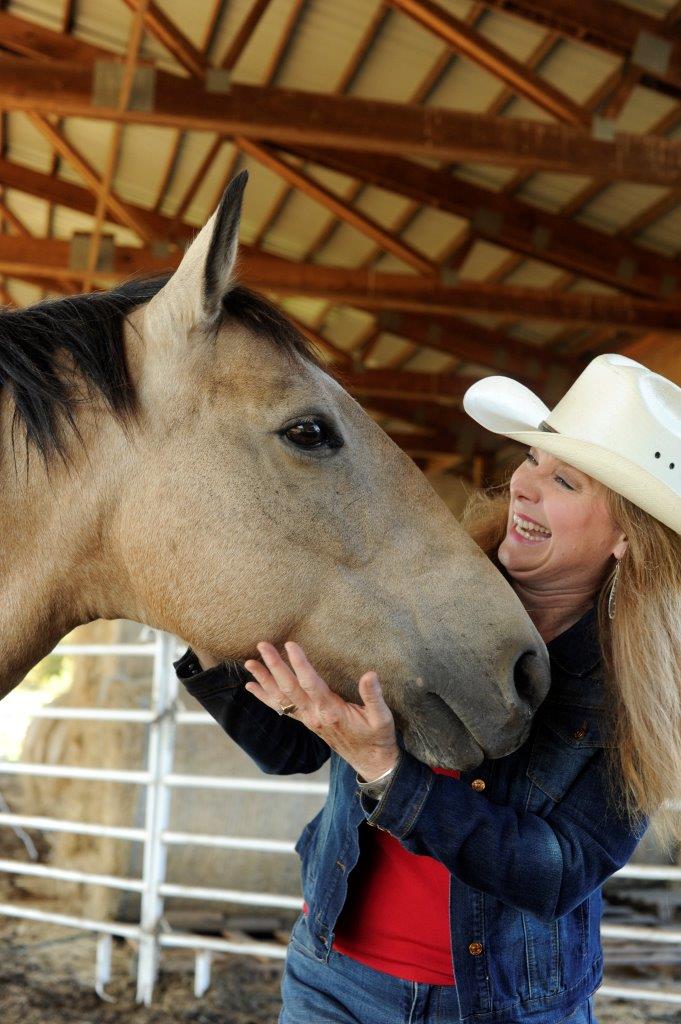 Kellie Grill loving one of her teaching horses